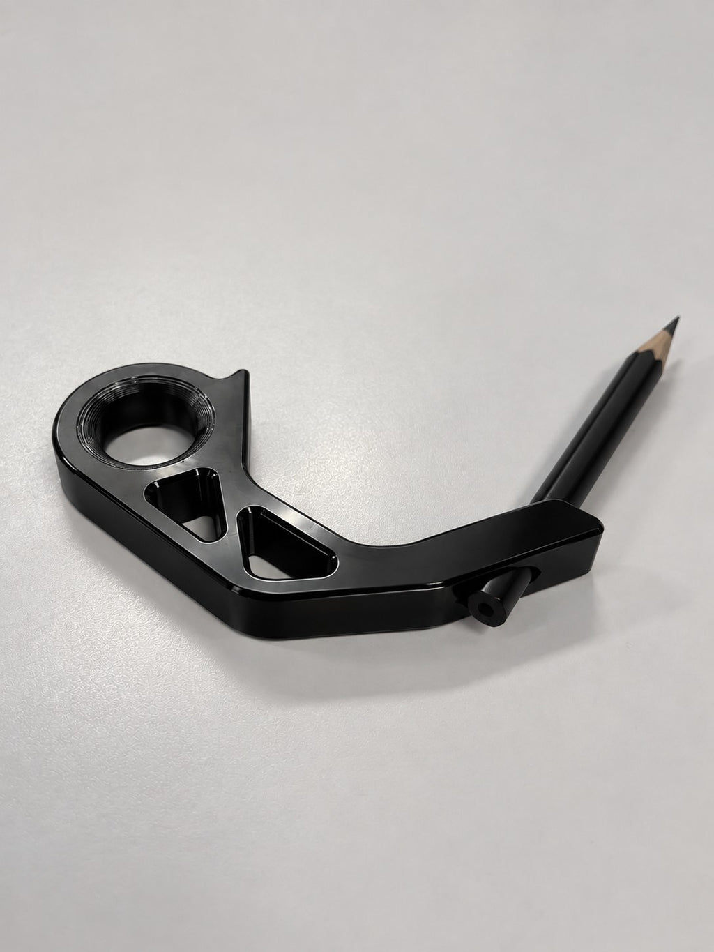 Spinstik attachment mod with pencil installed, on a desk